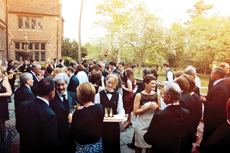 Guests enjoy appetizers and cocktails on the patio area at the Aldie Mansion following the fall wedding ceremony
