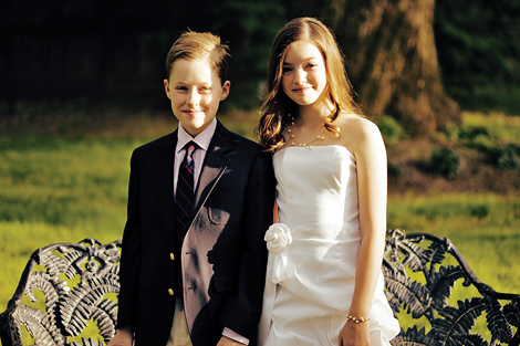 Two young guests pose for a shot before the outdoor ceremony at the Aldie Mansion
