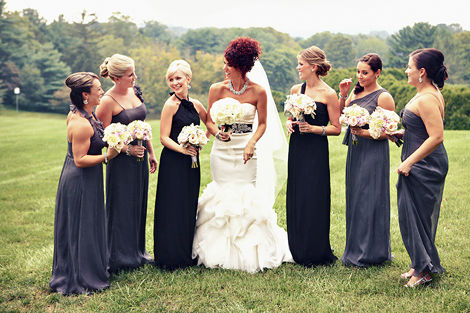 The bride stands with her bridesmaids before the wedding at Greenville Country Club; wearing black and gray gowns