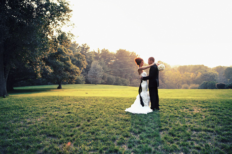The bride and groom share a private moment in the setting sun after their wedding ceremony at Greenville Country Club in Delaware