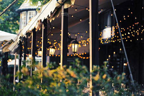 Lanterns and strings of light create a romantic and elegant setting for this summer wedding at Greenville Country Club