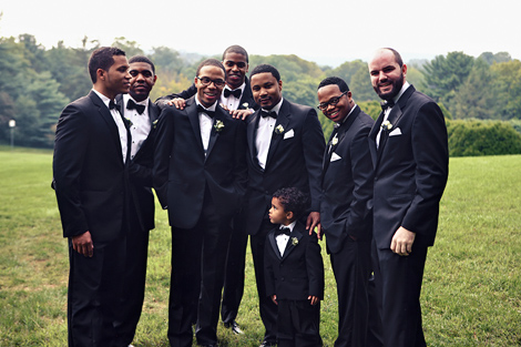 The groom poses with the groomsmen at Greenville Country Club before the wedding