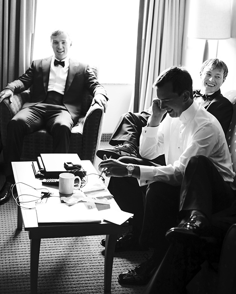 The groom and groomsmen relax in a hotel room before the wedding ceremony in Moorestown, New Jersey