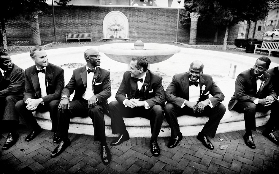 groom and groomsmen sit on fountain at the Penn Museum of Anthropology in Philadelphia