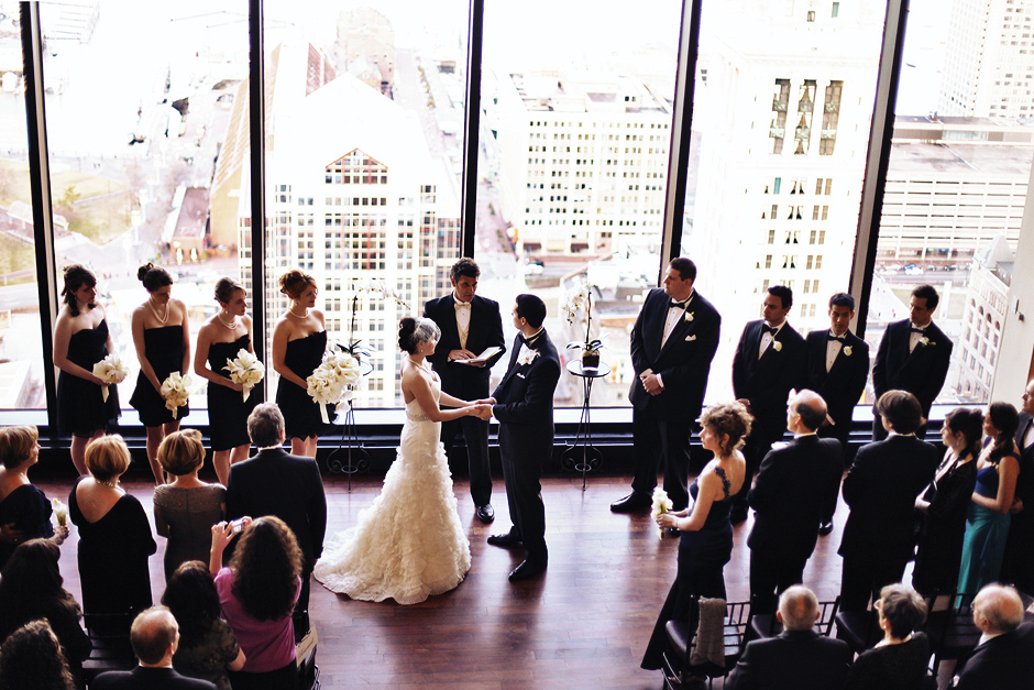 The bride and groom say their vows at their wedding at the State Room in Boston