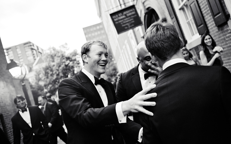 Groomsmen congratulate the groom on his marriage after the Philadelphia ceremony