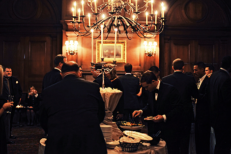 Guests enjoy cocktail hour at the Union League after the wedding