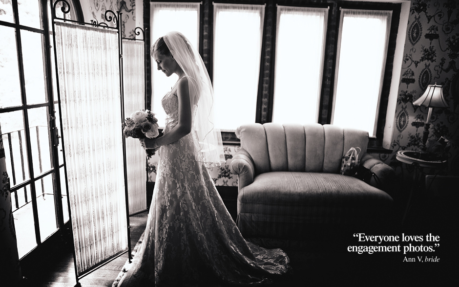 The bride looks down at her bouquet wearing her beautiful lace inspired A line gown and veil before her wedding ceremony at the Aldie Mansion in Pennsylvania, wedding photography by Peter Van Beever