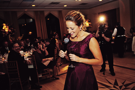 The maid of honor gives a toast in her purple dress at the indoor wedding reception at the Aldie Mansion in Pennsylvania