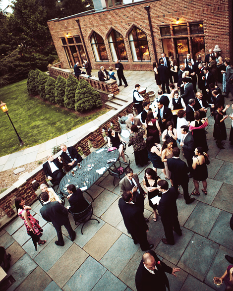 Guests relax, mingle, enjoy appetizers and cocktails at the coktail party following the wedding ceremony at the Aldie Mansion