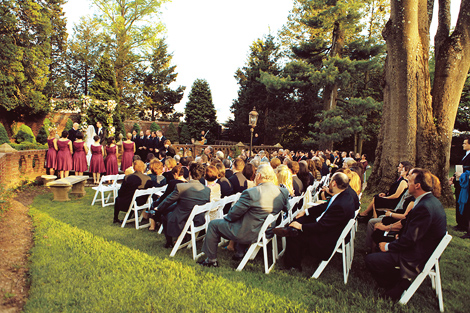 Guests look on as the bride and groom take their vows on a beautiful, sunny day at the Aldie Mansion