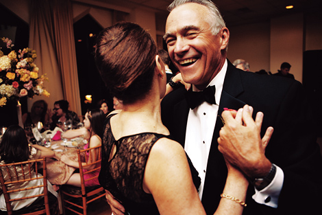 The groom's parents share a dance together at the wedding reception at the Aldie Mansion