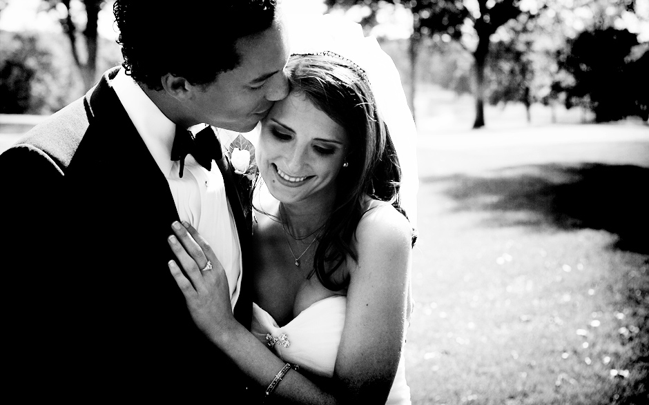 The bride and groom share a moment on the sunny golf course before their wedding ceremony, photographed by Peter Van Beever