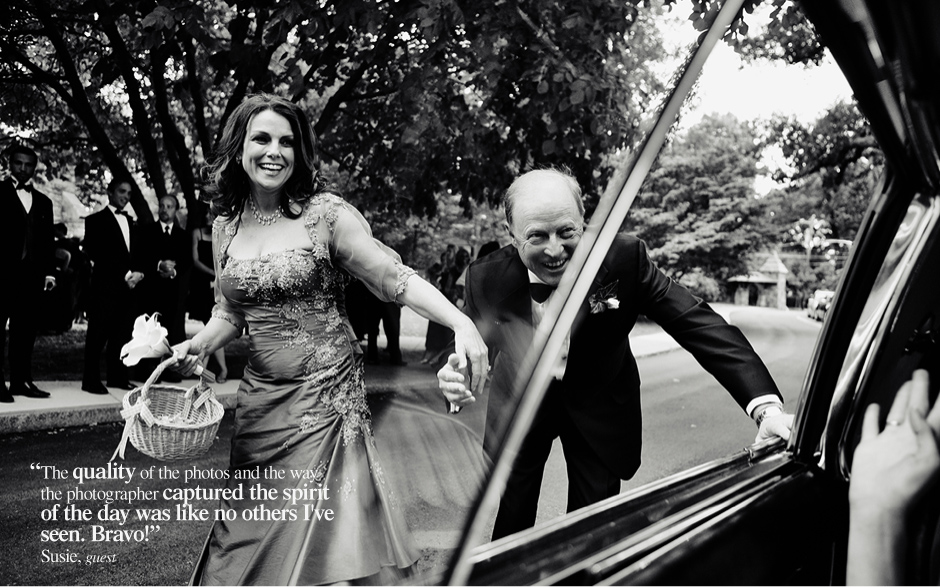 The parents of the bride run alongside the car as it pulls away with the bride and groom after their fall wedding