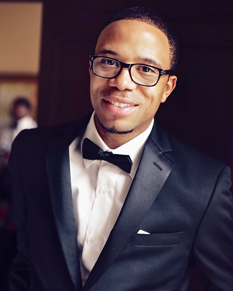 The groom poses for a portrait before the ceremony