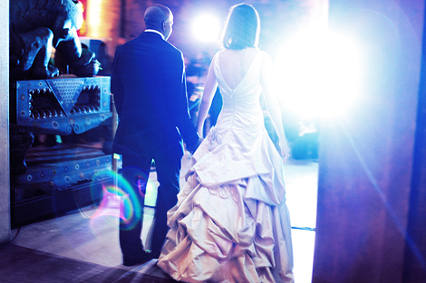 the bride and groom enter the reception holding hands at the Penn Museum of Anthropology in Philadelphia, PA, wedding photography by Peter Van Beever