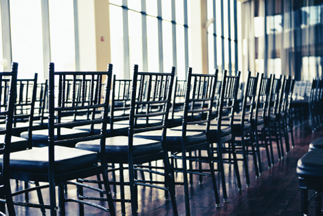 The wedding ceremony looks beautiful in the sunny afternoon light at the State Room in Boston