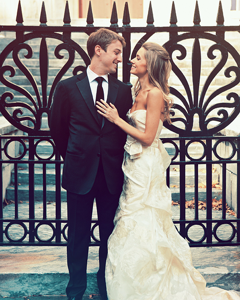 The brde and groom pose outside the bank building in Philadelphia, photographed by Peter Van Beever	