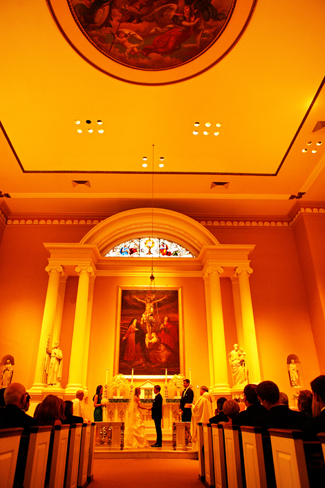 The bride and groom tie the knot in Old St. Joseph's Church in Philadelphia, PA