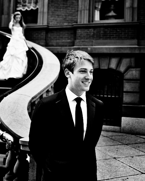 The groom waits at the bottom of the stairs at the Union League in Philadelphia as his bride descends for their first look